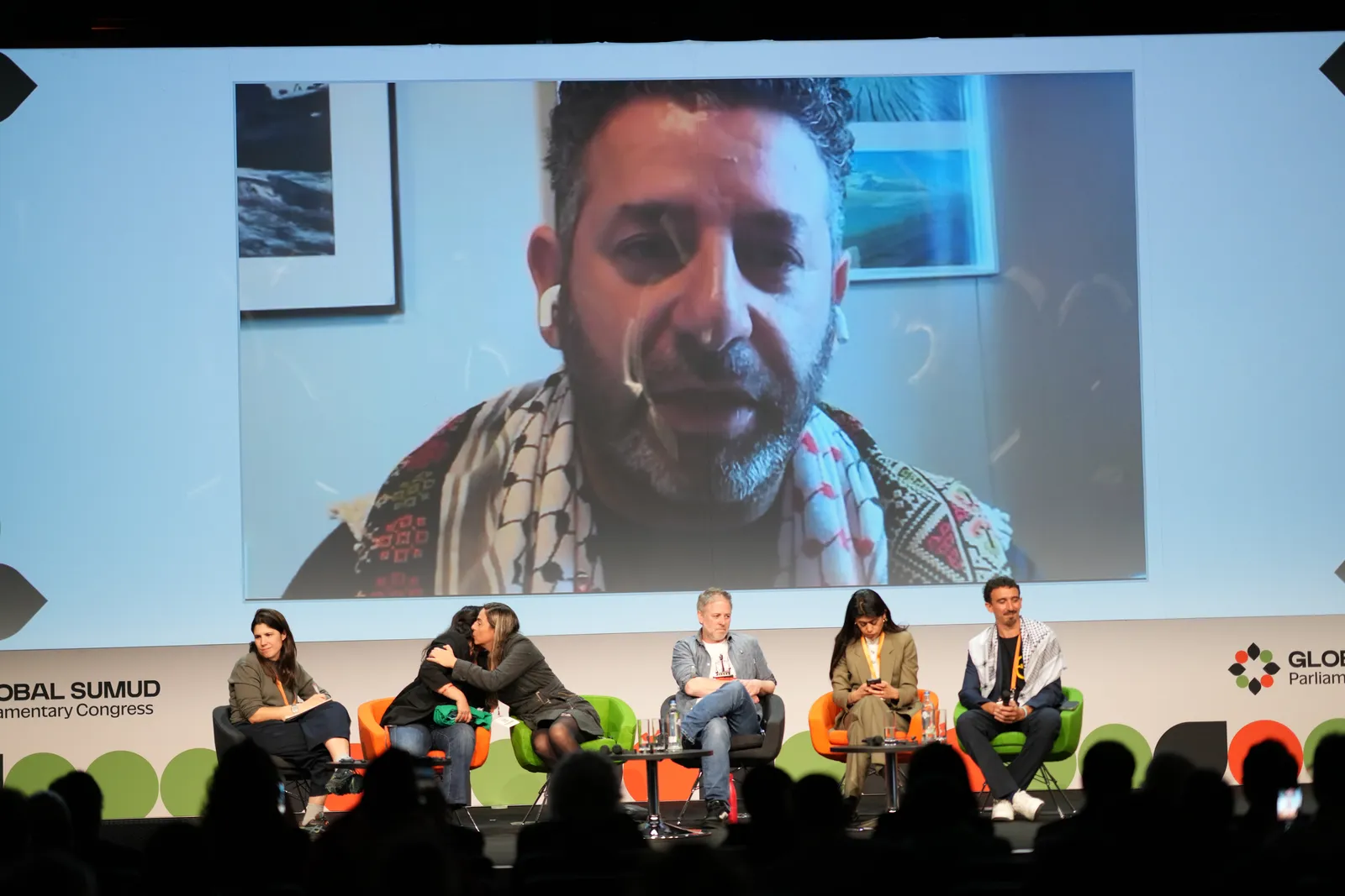 Saif Abukeshek addresses delegates by video link